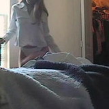 Bedroom spy cam caught this hot college girl undressed down to her sexy white thongs.