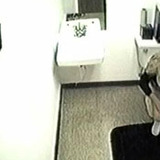 Lovely blonde captured on bathroom spy cam pulling down her sexy panties and pissing.